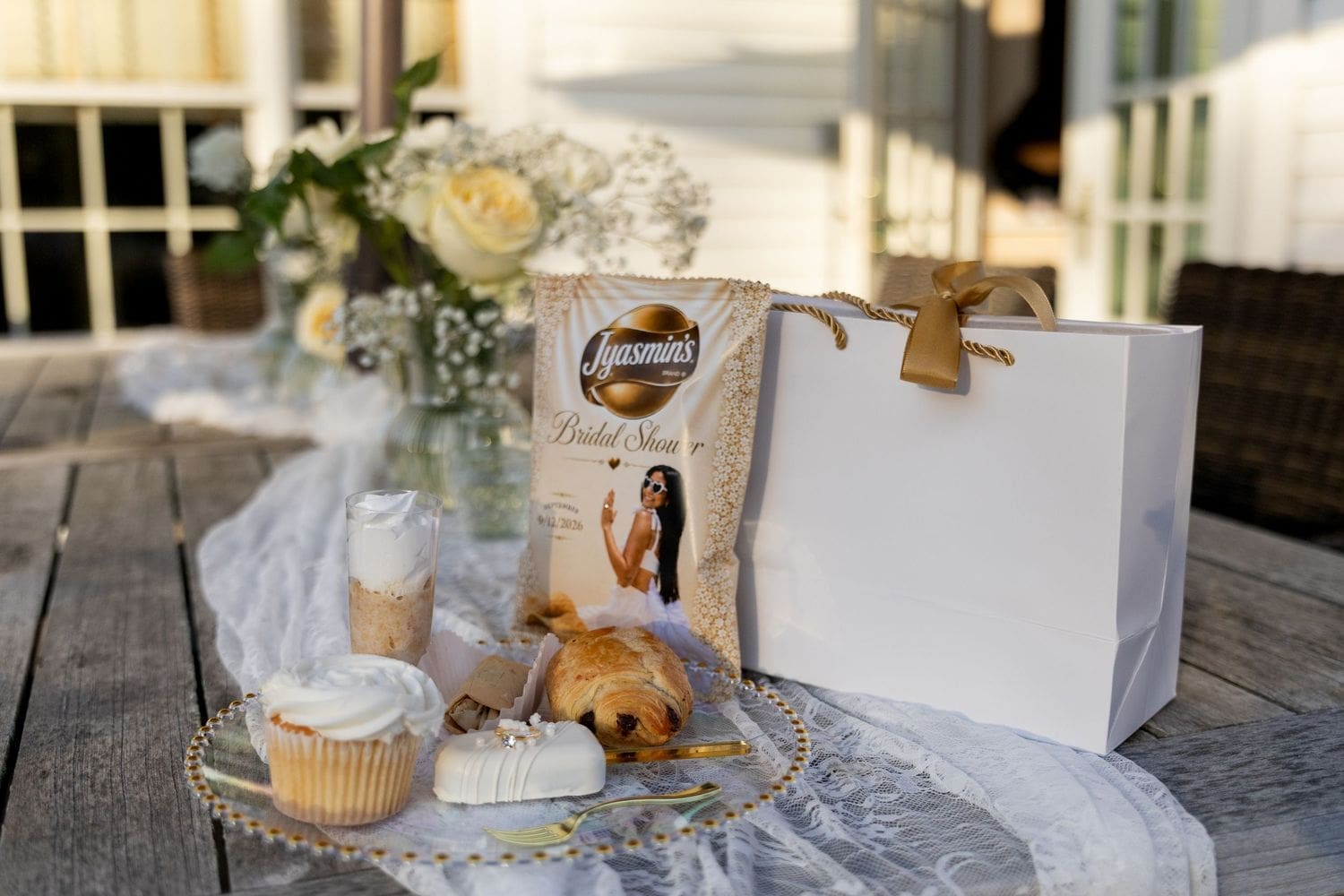 Bridal shower gift and cupcake details on a rustic table