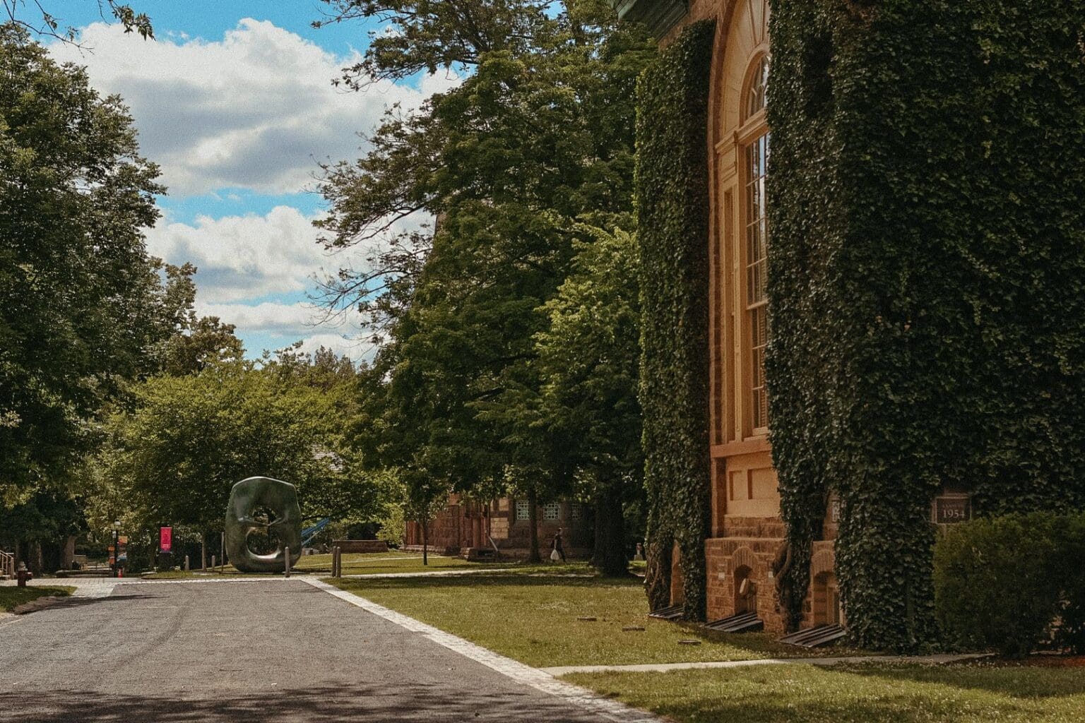 Ivy-covered stone building and tree-lined path at Princeton University